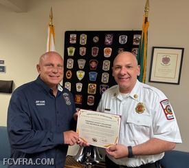 FCVFRA President Jeff Scire accepting certificate from Director Jason Blake.